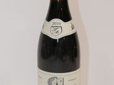 a bottle of wine that is sitting on a table