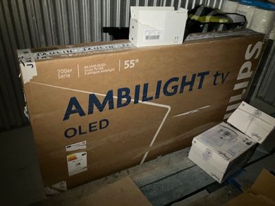a large box of amblight tvs sitting on a pallet