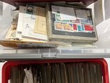 a lot of papers in a red box on a table