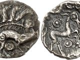 a silver coin with an image of a man on it