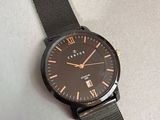 an image of a close up of a wrist watch on a table