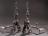 pair of antique cast iron candlesticks with figures on them