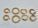 six pairs of gold hoop earrings and a pair of gold hoop earrings