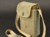 an old camera case with a strap on a black background