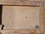 a picture of an old wooden frame with writing on it