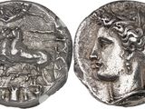 a silver coin with an image of a man on it