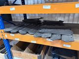 many pieces of metal on the shelves in the warehouse