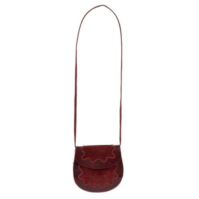 a small red purse with a flower design on the front