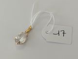 a close up of a small crystal pendant on a string with a price tag
