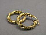 pair of gold toned hoop earrings with a snake design