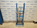 a close up of a blue ladder with a metal object on it
