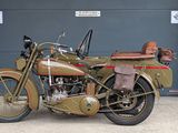 motorcycle parked in front of a garage door in front of a garage door