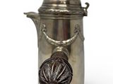 a silver coffee pot with a lid on a white background