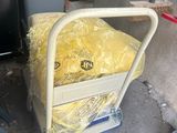 a cart that has a yellow bag on top of it