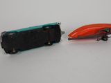 two toy cars sitting next to each other on a table