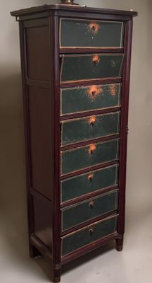 an image of a green and brown chest of drawers