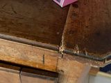 a pink box sitting on top of a wooden table