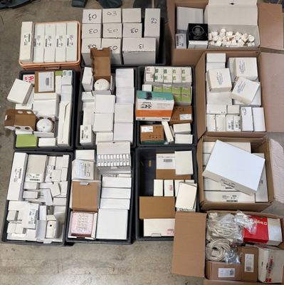 many boxes and boxes of electronic equipment on the floor