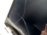 a hand that is pointing at the screen of a laptop