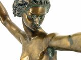 bronze statue of a woman holding a tennis racquet on a white background