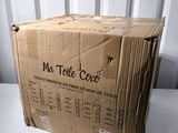 a box that is sitting on a table in front of a wall
