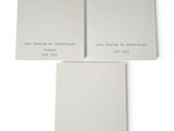 a couple of white paint samples sitting on top of each other