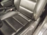 a picture of a car seat with a dirty seat belt