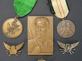 some of the medals and medals are on display on the table