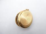 an image of a gold locke on a white surface