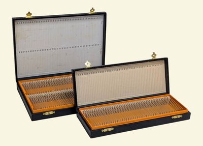 two open briefcases sitting side by side on a white surface