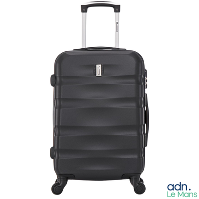 the black suitcase is on wheels and has a handle