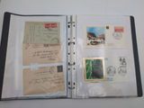 a binder with a lot of postcards and stamps on it