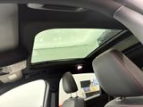 the interior of a car with a view of the sunroof