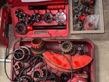 a red tool box with a lot of tools inside of it