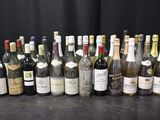 many bottles of wine lined up on a table