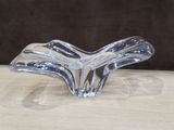 clear glass vase on a wooden table with a brown background