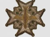 a close up of a star shaped badge on a white surface