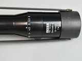 an image of a close up of a camera lens on a tripod
