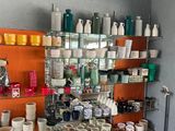 a room filled with lots of pottery on shelves