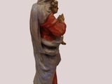 figurine of a woman holding a child in her arms