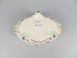 a white plate with a green and white design on it