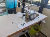 a sewing machine sitting on a table in a room