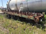 a train car that is sitting on the tracks in the grass