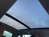 a woman sitting in the back seat of a car