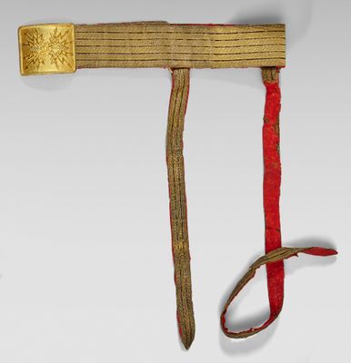 a red and gold belt with a gold buckle on it