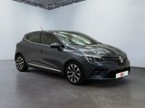 a grey renault c - cross parked in a white room