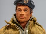 a close up of a toy soldier wearing a jacket and hat