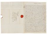 a letter written in arabic on a piece of paper with red ink