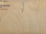 an old envelope with a handwritten message on it sitting on top of a table