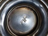 a close up view of a silver cup on a table